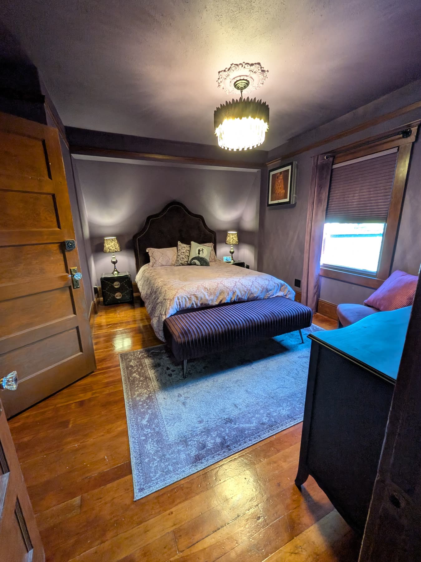 Primary bedroom alternate view with hardwood floors